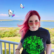 Versiris real photo wearing her Johto Bug Catching Contest T-Shirt with butterfree flying in the background
