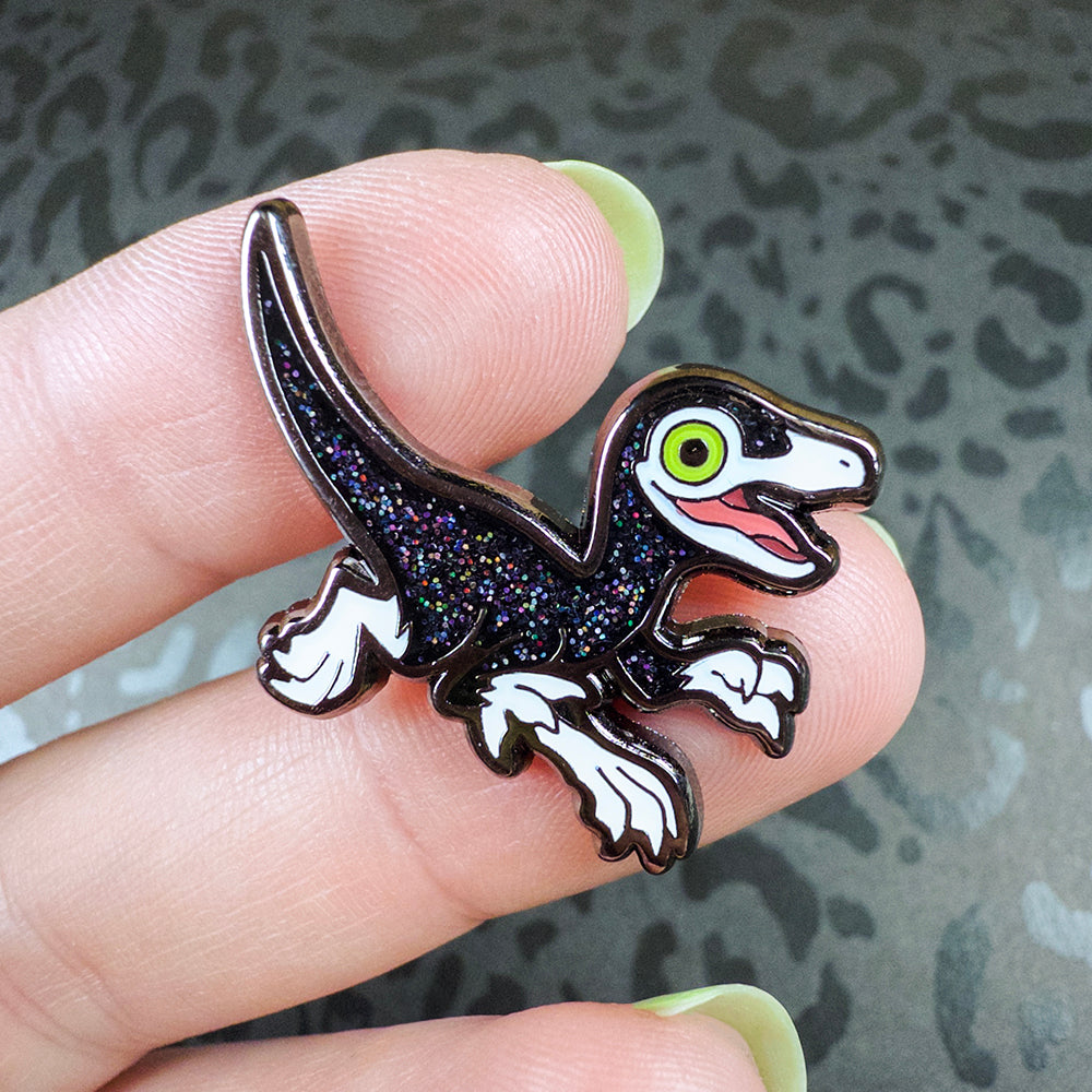 Jurassic Attack! Black Sparkle Compsognathus Enamel Pin - Versiris - Art by Versiris